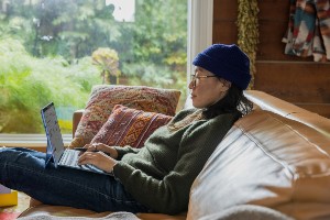 Woman with Beanie and Laptop